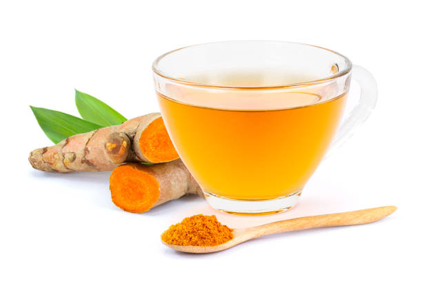 A warm cup of Turmeric Glow herbal tea with golden turmeric color